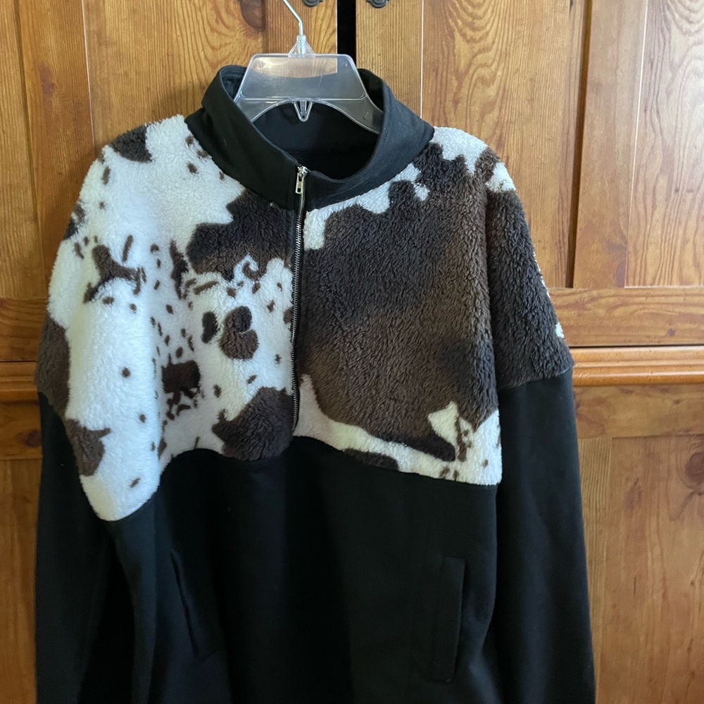 Woman’s size large half zip black/cow print sweater with pockets